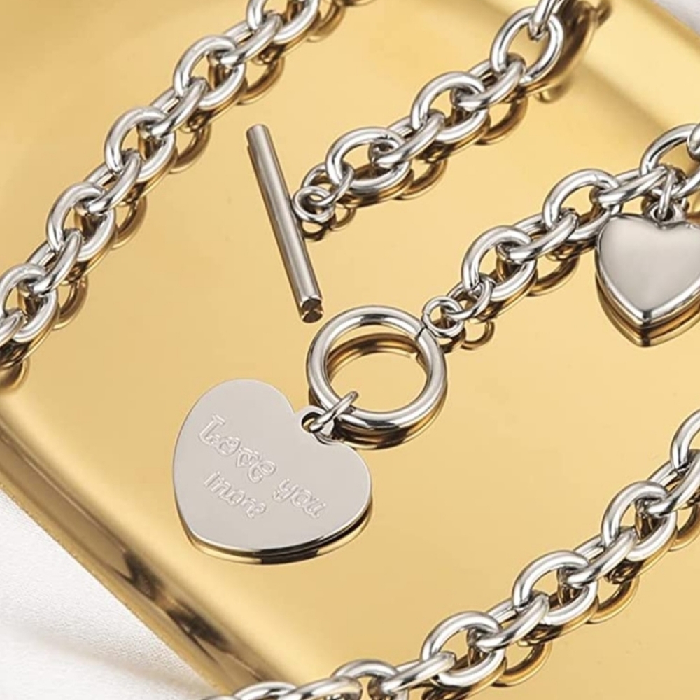 Stainless steel hearts Love you more.engraved necklace.  Toggle closure. 19 inch